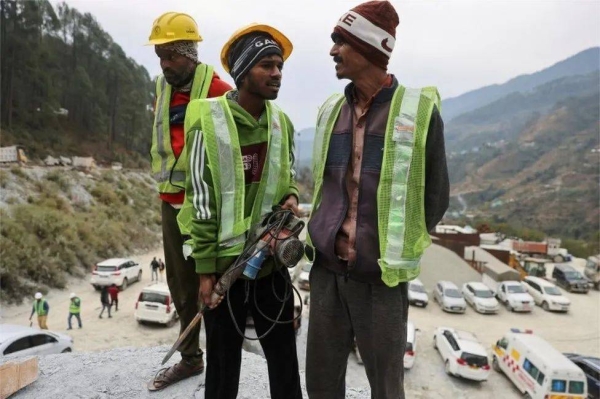 A dozen so-called 'rat-hole' miners cleared the last stretch of debris to reach the trapped workers