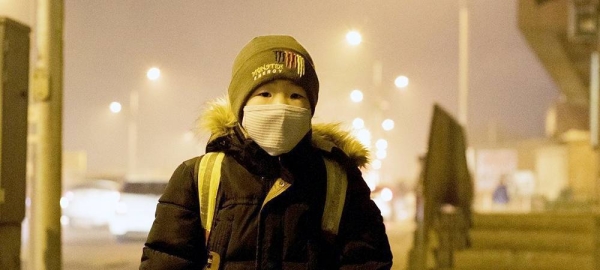 A boy waiting for his school bus in the Songinokhairkhan district of Ulaanbaatar, Mongolia, where air pollution levels are dangerously high. — courtesy UNICEF/Mungunkhishig Batbaatar