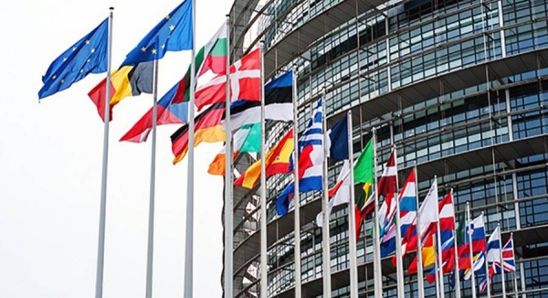 File photo of European Union (EU) flags next to the European Commission building in Brussels, Belgium.