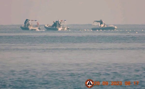 Chinese Coast Guard boats near the Scarborough Shoal in the South China Sea in September, in a handout image released by the Philippine Coast Guard. — courtesy Philippine Coast Guard/Reuters