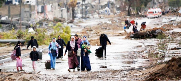 Displaced people walk from the north of Gaza towards the south, as ambulances head in the other direction. (file). — courtesy UNRWA/Ashraf Amra