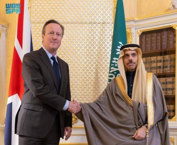 British Foreign Secretary David Cameron receiving Saudi Minister of Foreign Affairs Prince Faisal bin Farhan in London on Thursday