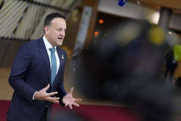 Ireland's Prime Minister Leo Varadkar speaks with the media as he arrives for an EU summit at the European Council building in Brussels, Thursday