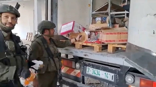 A video posted online shows Israeli soldiers burning food in Gaza