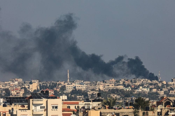 A picture taken from Rafah shows smoke billowing over Khan Yunis in the southern Gaza Strip following Israeli bombardment on December 15, 2023, amid continuing battles between Israel and the Palestinian militant group Hamas. (Photo by SAID KHATIB / AFP) (Photo by SAID KHATIBSAID KHATIB/AFP via Getty Images)