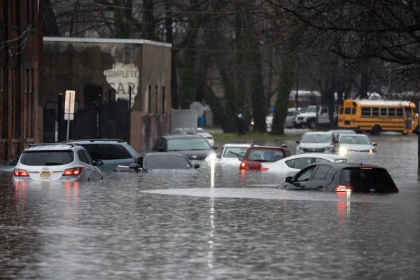Cars were left stranded in floodwaters on River St in Paterson, New Jersey, on Monday Dec. 18, 2023