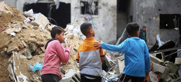 Children look at their destroyed homes in Rafah city, in the southern Gaza Strip. — courtesy UNICEF/Eyad El Baba