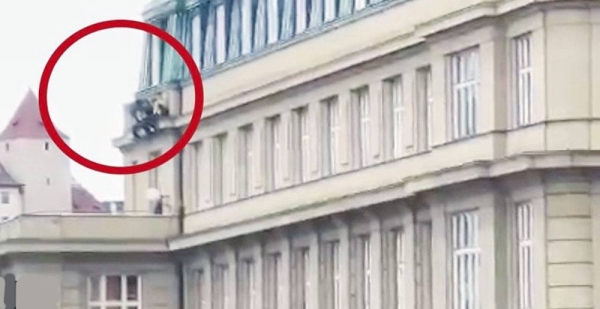 Screenshot shows people are seen leaping from building ledge in Prague,
