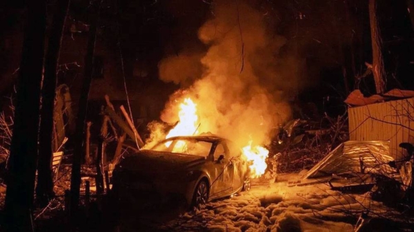 A view of a burning car following a Russian missile strike on a residential building in Kharkiv, on Saturday. — courtesy EPA