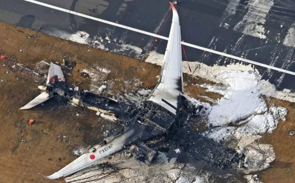 This aerial photo show the burn-out Japan Airlines plane at Haneda airport on January 3, 2024, in Tokyo, Japan