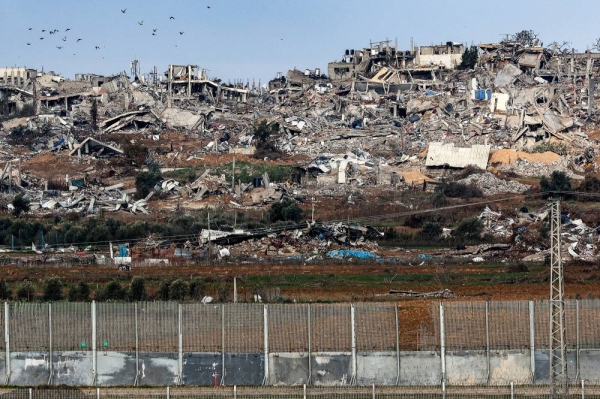 This picture taken on January 3, 2024 shows a view of buildings destroyed by Israeli bombardment in the central Gaza Strip from a position across the border in southern Israel amid the ongoing conflict between Israel and the Palestinian militant group Hamas. (Photo by JACK GUEZ / AFP) (Photo by JACK GUEZ/AFP via Getty Images)