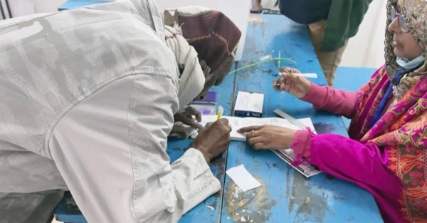 Bangladesh Prime Minister Sheikh Hasina talks to the Electoral officials after casing her vote in the Bangladesh's general election in Dhaka on Sunday.