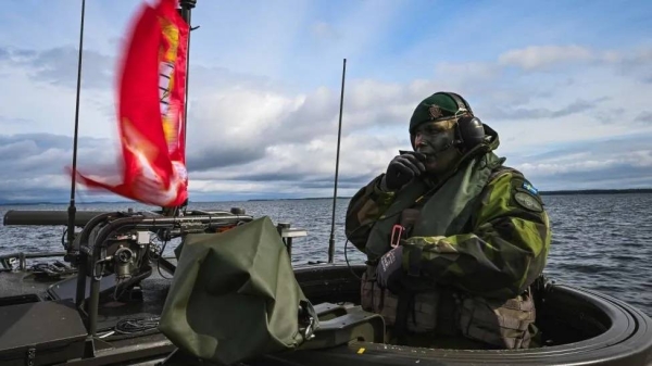 A soldier from the Swedish Amphibious Corps is pictured on board the CB90-class fast assault craft, as they participate in the military exercise Archipelago Endeavor 23 on Mallsten island in the Stockholm Archipelago on September 13, 2023
