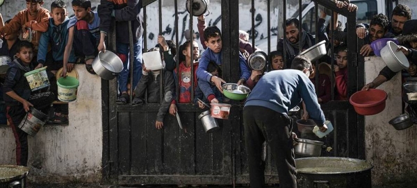 Children wait to be served food in Rafah, in southern Gaza Strip. — courtesy UNICEF/Abed Zagout