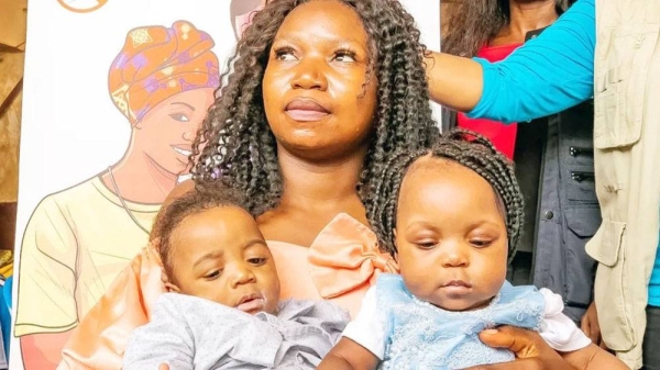 Eight-month-old Daniella, right, with her mother and twin brother, is the first Cameroonian child to get the jab. — courtesy AFP