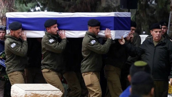 Israeli soldiers carry the casket at the funeral of one reservist killed in Monday's attack. — courtesy Reuters