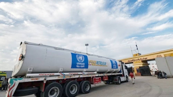 A truck of the UN Relief and Works Agency for Palestine Refugees (UNRWA) carrying fuel arrives at the Egyptian side of the Rafah border crossing with Gaza. — courtesy Getty Images