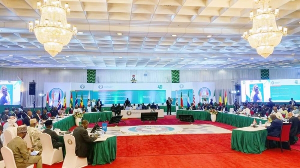 Dozens of people sitting in a meeting room for a Economic Community of West African States gathering. — courtesy Reuters