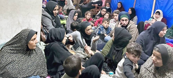 Women and children take shelter in an overcrowded UNRWA facility in Khan Younis, Gaza, amid nearby gunfire and shelling. (file). — courtesy © UNRWA/Hussein Owda