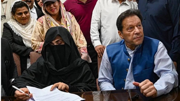 Imran Khan and his wife Bushra Bibi as seen last July posting bail