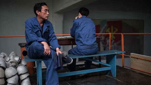 Workers at an electric cable factory in North Korea