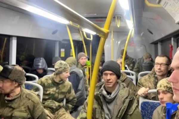 Freed Russian service personnel in a bus following the latest prisoner exchange.