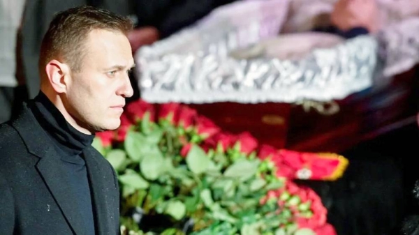 Russian opposition leader Alexei Navalny pays his last respects to Lyudmila Alexeyeva, a Soviet-era dissident who became a symbol of resistance in modern-day Russia as a leading rights activist, in Moscow on Dec. 11, 2018. — courtesy Getty Images