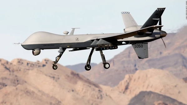 In this 2015 file photo, an MQ-9 Reaper remotely piloted aircraft flies by during a training mission at Creech Air Force Base in Indian Springs, Nevada