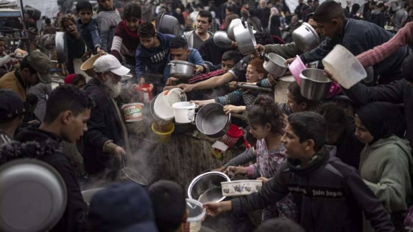 Palestinians line up for a free meal in Rafah, Gaza Strip. (File)