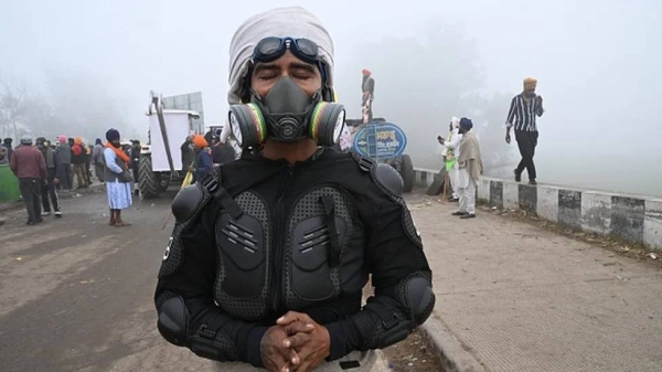 Farmers are using masks, gloves and safety suits to protect themselves from tear gas shelling