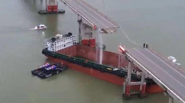 A cargo ship rammed into a bridge in China, plunging vehicles into the river