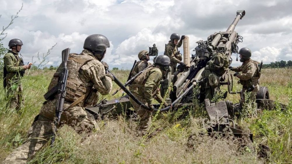 In this July 2022 photo, Ukrainian servicemen prepare to fire at Russian positions from a US-supplied M777 howitzer in Kharkiv region of Ukraine. — courtesy AP