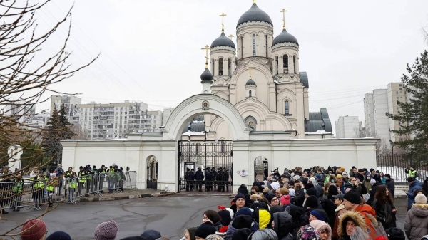 People gather outside a Moscow church ahead of Navalny's funeral amid heavy police presence, March 1, 2024