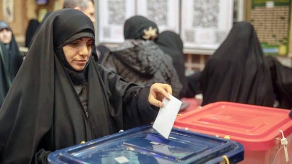Iranian people cast their votes for 12th term of the parliamentary elections and the 6th term of the Assembly of Leadership Experts at a polling station. —courtesy Getty Images