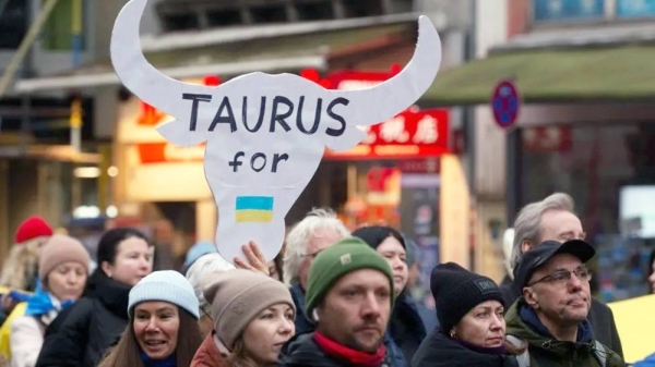 Germans call on their government to arm Ukraine with Taurus missiles in a march in Cologne. — courtesy Getty Images