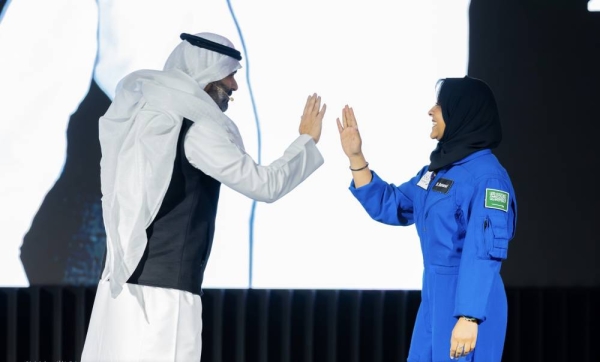 Minister of Communications and Information Technology Eng. Abdullah Al-Swaha shares a light moment with Saudi female astronaut Rayyanah Barnawi on the sidelines of the opening ceremony of the 3rd edition of LEAP Tech Conference 2024 in Riyadh on Monday.