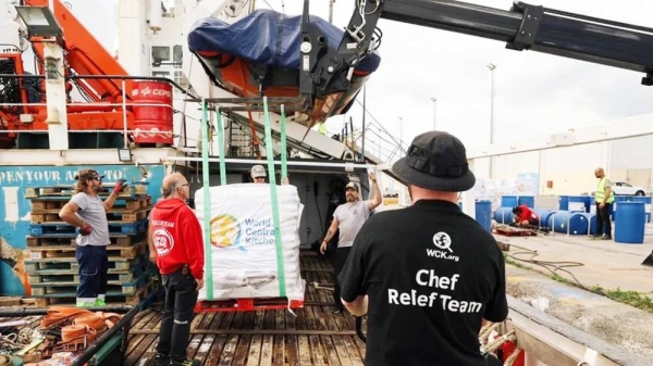 Picture of a crane loading a pallet of aid onto a ship belonging to Spanish charity Open Arms. — courtesy World Central Kitchen/Open Arms