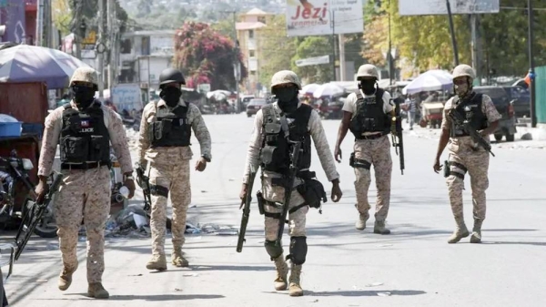 Police patrol a street in Port-au-Prince, Haiti. — courtesy Reuters