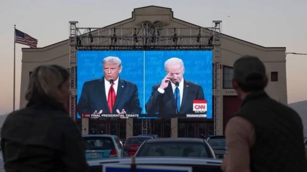 Viewers watch a 2020 presidential debate between Joe Biden and Donald Trump. The two will likely face off again this year