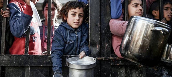 In Gaza, children wait to receive food as bombardments in the enclave and fighting continue. (file). — courtesy UNDP PAPP/Abed Zagout