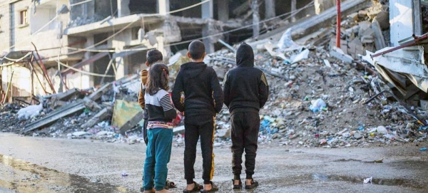 Children stand in front of a house demolished by a bombardment in the city of Rafah, south of the Gaza Strip... — courtesy UNICEF/Eyad El Baba