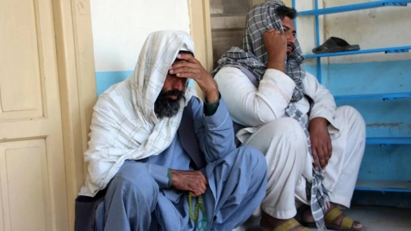 Relatives attend the funeral of a man killed in a suicide attack in Kandahar