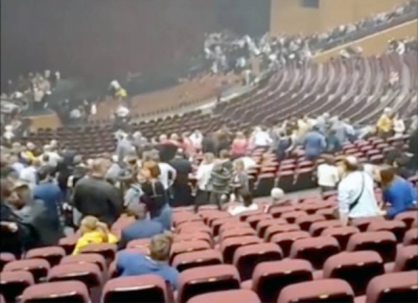 Screengrab shows people taking cover inside the venue as multiple shots are heard.