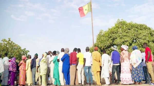 Seven million people, some seen here queuing in Ndiaganiao on Sunday, are eligible to vote. — courtesy BBC