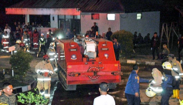 A firefighting vehicle prepares to work at the site of an explosion in Bogor, West Java, Indonesia, Sunday. — courtesy Xinhua