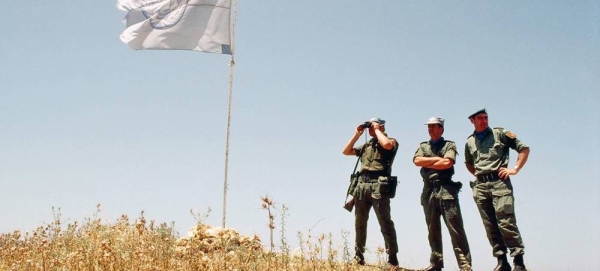 Three soldiers of the Irish Battalion attached to UNIFIL on look-out duty at Hill 88 overlooking At Tiri. — courtesy UN Photo/John Isaac