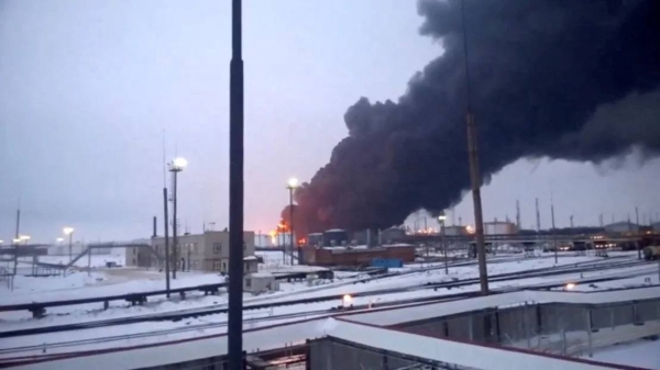 Smoke billows after a Ukrainian drone strikes a refinery in Ryazan, Ryazan region, Russia, in this screen grab from a video obtained by Reuters, March 13, 2024