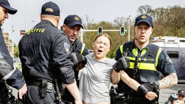 Greta Thunberg arrested by police officers. — courtesy EPA