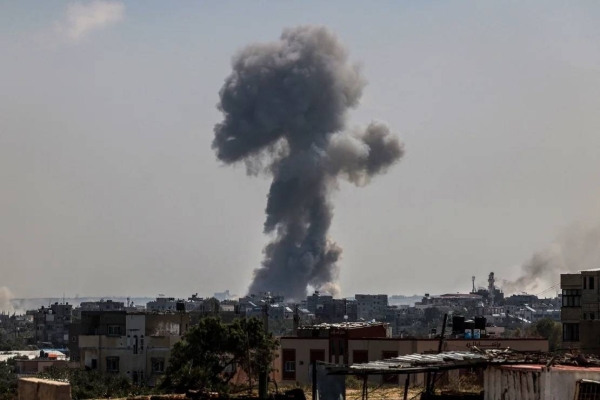 Smoke billows following a strike in Nuseirat refugee camp, in central Gaza. Several journalists, including a CNN stringer, were injured in the attack on April 12