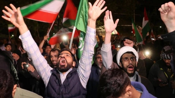 Iranian demonstrators in Tehran react after the attack on Israel